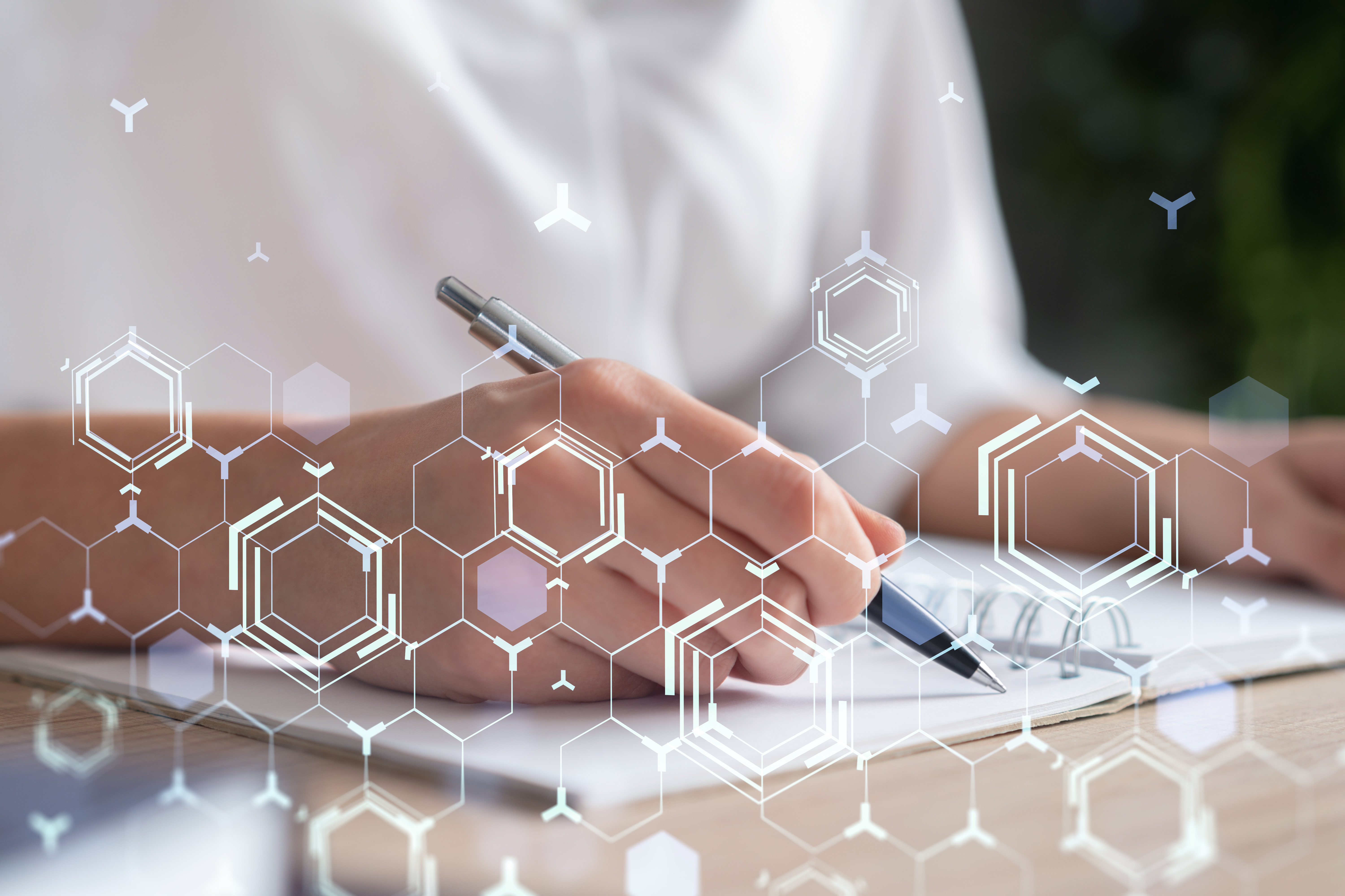 Businesswoman is writing down some ideas to create innovative software to change the world and provide a completely new service. Close up shot. Hologram tech graphs. Concept of Dev team. Formal wear.